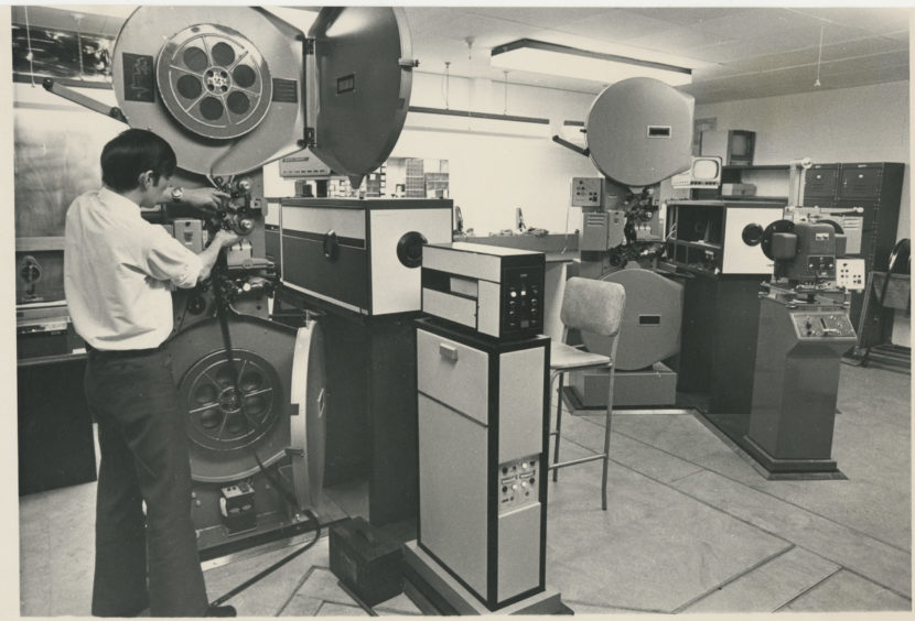 1971: Behind the scenes at Grampian Televisions studios at Queen's Cross, Aberdeen, as David Burns loads the telecine unit