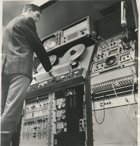 1971: Television represents the height of achievement in the world of electronics and the going over to colour by Grampian Television cost £250,000.  This image shows David Burns at the telecine control panel at Grampian Television’ Aberdeen headquarters.