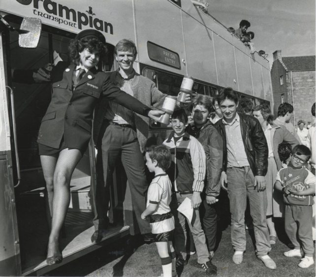 1986: Dons star Alex McLeish and Terry Glossotis welcome passengers for a free trip round town at yesterday's Grampian Transport open day. They also collected donations for the Linn Moor appeal.