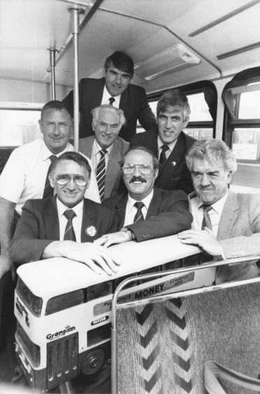 1991: Still on the buses after many years work are six Grampian Regional Transport employees, who received long service awards from the company. In the front row are (from left) Alex Wilson (bus driver for 35 years), Alex Sutherland (bus driver for 40 years) and Lenny McDonald (electrical engineering supervisor for 40 years). Getting awards for 25 years service are (back row, from left), Kenny Esson (bus driver) Stanley England (bus cleaner), managing director and chairman of the company Moir Lockhead and Gordon Craig (bus driver).