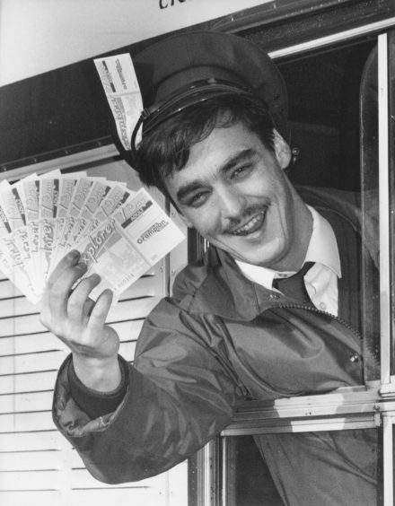 1992: Grampian Transport bus driver Shaun Gray, Bridge of Don, shows off the lucky bus pass tickets you could win if you help Cut The Rush.