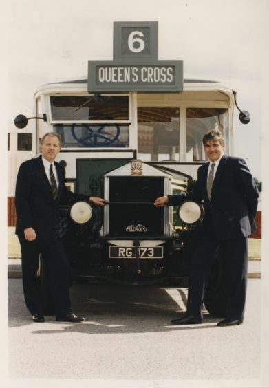 1994 Managing director Robbie Duncan (left) and chairman Moir Lockhead, seen beside an old Aberdeen bus at yesterday's AGM held in the Aberdeen Exhibition and Conference Centre.