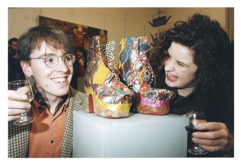 1992: Co-ordinators Simon Cowan and Claire Broadfoot look over some of the items in the Gray's School of Art exhibition at the Aberdeen Arts Centre, where they had to draw up some last minute plans after years of showing in Aberdeen Art Gallery.