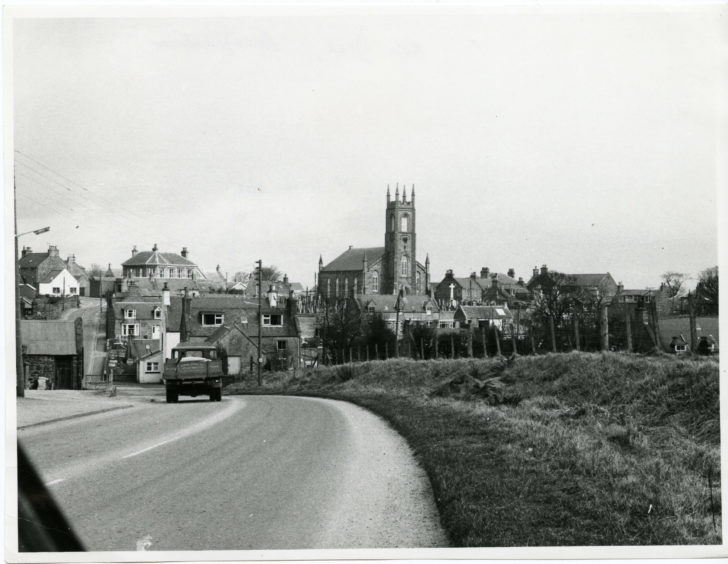 1978: New Deer, Aberdeenshire. St Kanes Church can be seen in the background.