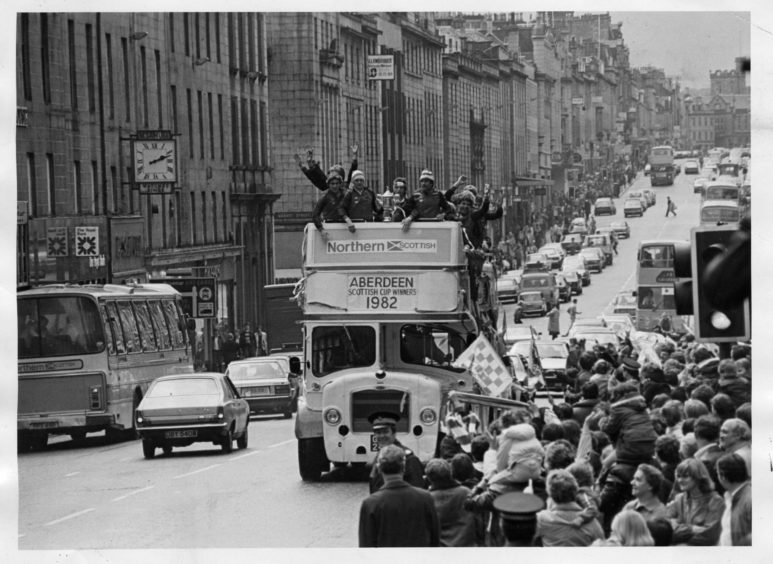 1982: Aberdeen FC aboard the bus, going through the town after they won the Scottish Cup.