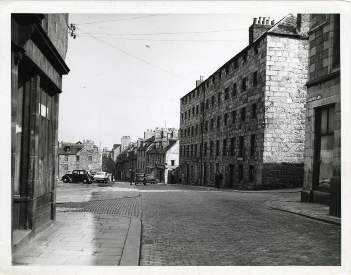 1958: The old entry to Aberdeen from the north by way of the Brig o' Balgownie showing the Gallowgate with the sites of old demolished buildings on the left.