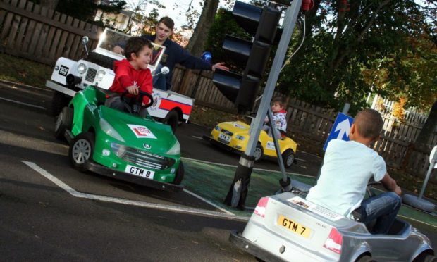 Kids learning how to drive at Grampian Transport Museum's junior driving school