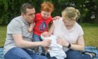 Douglas Ross with wife Krystle, eldest son Alistair, two, and newest arrival, James at their home in Moray.