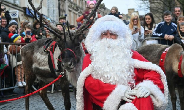 Santa himself joined in the festivities in Elgin on Saturday. Picture by Jason Hedges.