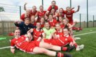 The Aberdeen FC Women squad celebrate after winning the title at Dundee United
