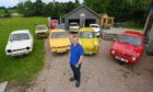 Hobby vintage vehicle restorer Lewis Buchan with some of his 11 three-wheeled vehicles. DCT Media/Kenny Elrick