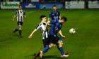 Fraserburgh's Sean Butcher, left, and Huntly's Cameron Booth battle for the ball