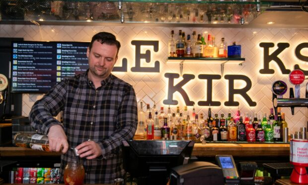 Raising the bar: Michael McMillan, the general manager at The Triplekirks, enjoys chatting to the characters who come into the city centre pub.
