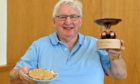 Johnnie Wiseman with his winning trophy for the traditional oatcake category..