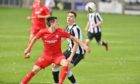 Brora's John Pickles and Fraserburgh's Paul Campbell battle for the ball