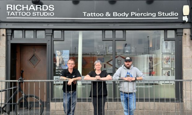 Richard Pinch, Joanne Wrigley and Will Massie are offering free removal of radiotherapy marks at the studio. Picture by Kami Thomson.