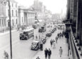 1958: Bikes, buses, cars and vans and even a horse and cart pass the Music Hall
