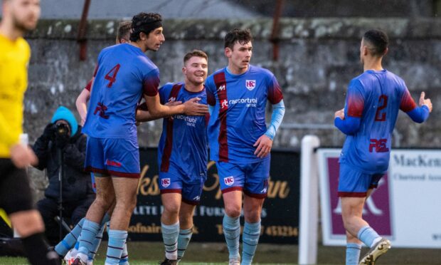 Keith players celebrate Scott Gray giving them the lead against Nairn County