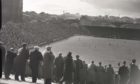 1957: Crowds watch on at a match at Pittodrie Park, Aberdee, the home of Aberdeen FC.