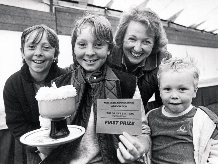 1985: No prizes for telling how well Jane Fowlie,12, did in the under 16 years individual dessert competition at New Deer Show yesterday. Congratulating Jane, Loanhead, New Deer, on her tasty treat are mum, Pamela, sister Suzanne, 10, and four-year-old brother John, who seems to be licking his lips ready to give his personal verdict on the winning entry.