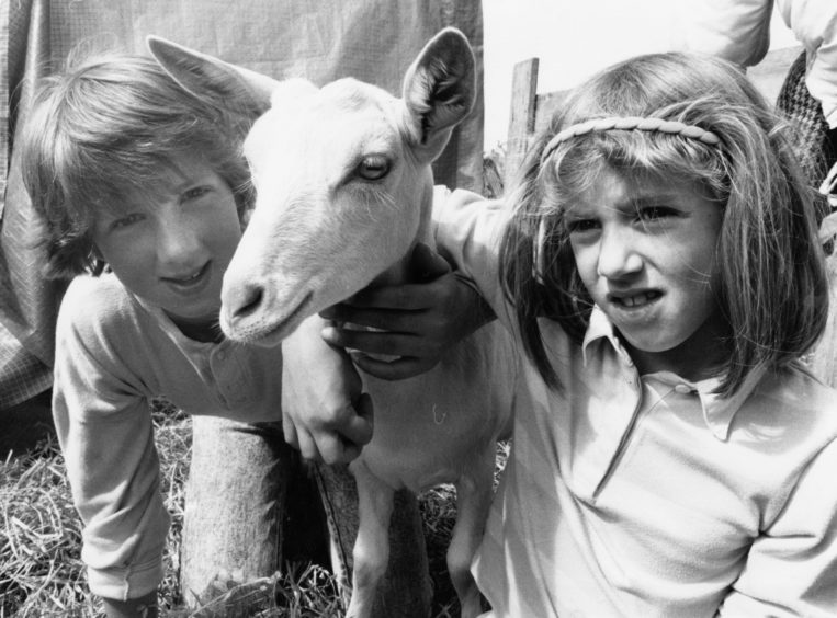 1988: All kids together ... Mary Ross and sister Rosana, Balmedie Farm, with one of their goat kids, Flax, at the New Deer Show on Saturday.