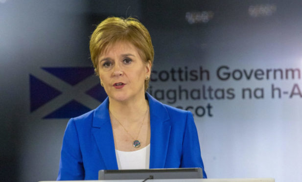 First Minister Nicola Sturgeon is answering questions about the latest NHS situation. Photo: PA