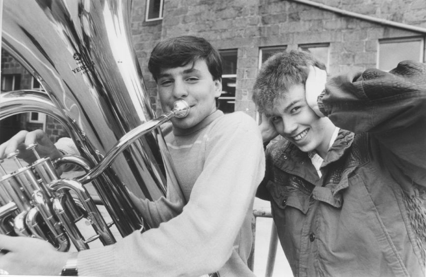 1985: Martin Burgess, Ellon, gets a friendly ribbing from fellow tuba player Stuart Presly, Oldmeldrum, after winning the Under 18 Class.