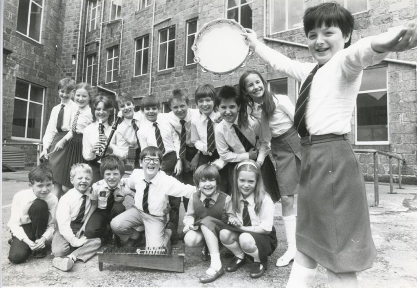 1987: Foveran School, Newburgh, came first in the group music making competition yesterday at the Aberdeen and North East Scotland Music Festival. Moira Black shakes the tambourine.