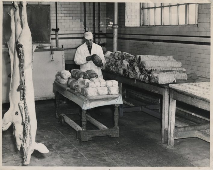 1961 - Butchery assistant William Gallacher prepares cooked meats at Berryden for delivery to shops