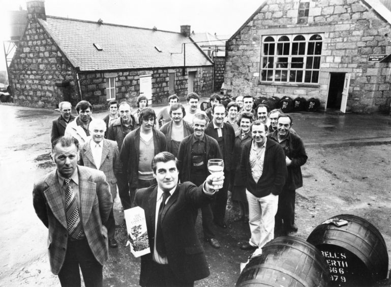 1979: Glen Garioch Distillery manager Willie MacNeill makes a toast with a sample of their malt whisky