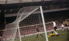 Denis Law scores for Scotland against England at Wembley in the famous 3-2 win.