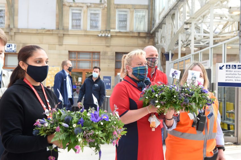 LNER staff prepare to lay wreaths at Aberdeen station.