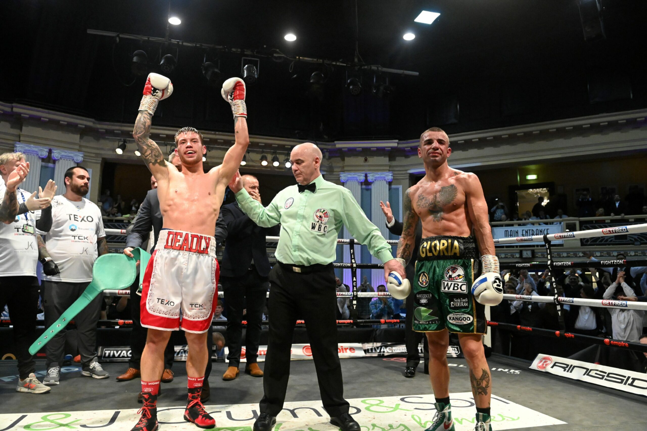 Aberdeen boxer Dean Sutherland wins the WBC Silver International title. With referee Victor Laughlin and Michele Esposito.