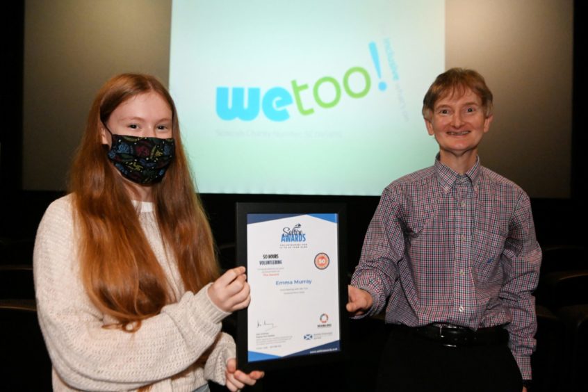 Emma Murray receiving her Saltire award from Mike Melvin of ACVO. Picture by Paul Glendell.