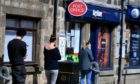 Customers queuing outside the Oldmeldrum post office in May 2020. Photo: Chris Sumner/DCT Media