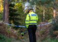 An officer at the scene in Birkenhill Woods
