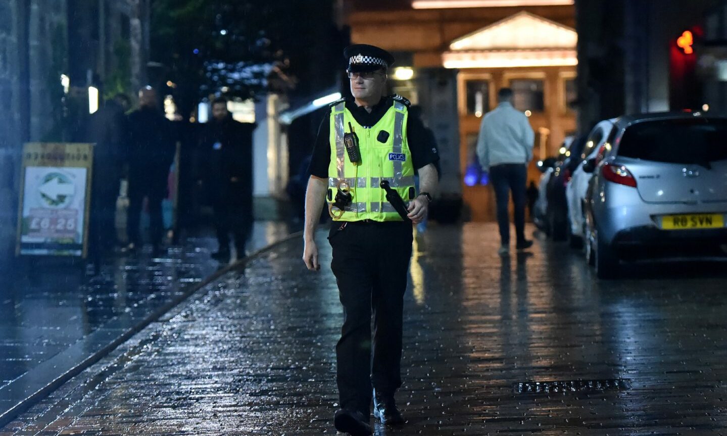 A police officer on patrol in Belmont Street in Aberdeen city centre.