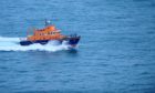 Stornoway Lifeboat went to rescue the dog after it was spotted by chance