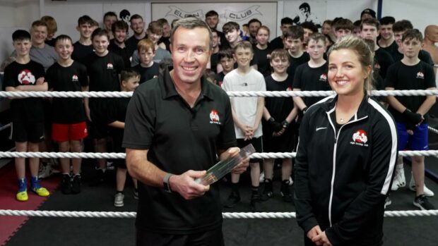 Elgin Boxing Club coach Paul Gordon with his BBC Sports Personality of the Year Unsung Hero award, which was handed over by his daughter Megan.