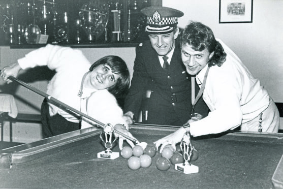 Christine Robertson, Elgin, winner of the women’s competition in the Grampian Police pool competition for disabled people, with men’s winner Ronald Reid, Aberdeen, and Superintendant Brian Bruce