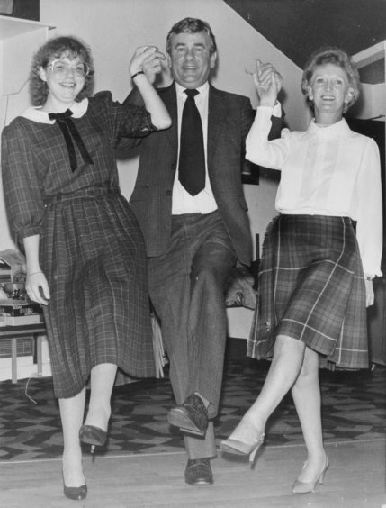 1985: Special guest Jimmy Spankie was first on the dance floor with not one but two of the committee, (left) Linda Smith (Chairwoman) and (right) Betty Scorgie the social convener at the Pro Arte St Andrews evening.