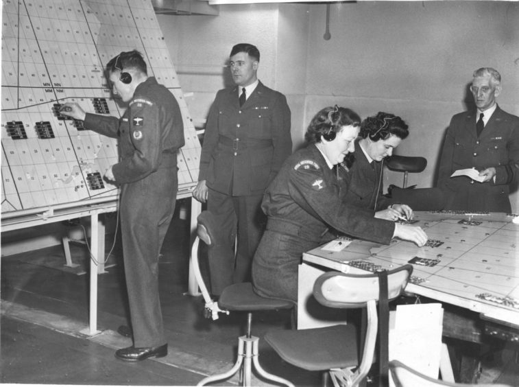 1961 - Members of the Royal Observer Corps at work in the Control Room in the new operation centre at Quarry Road, Northfield. The centre was officially opened in May 1961