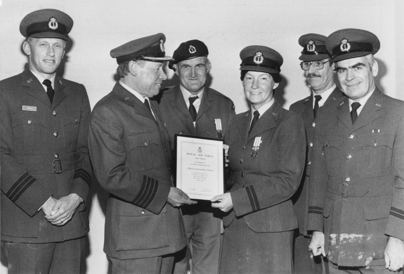1986 - A double presentation for long service to Observer Lt. Carole Allerton and Observer John Henderson