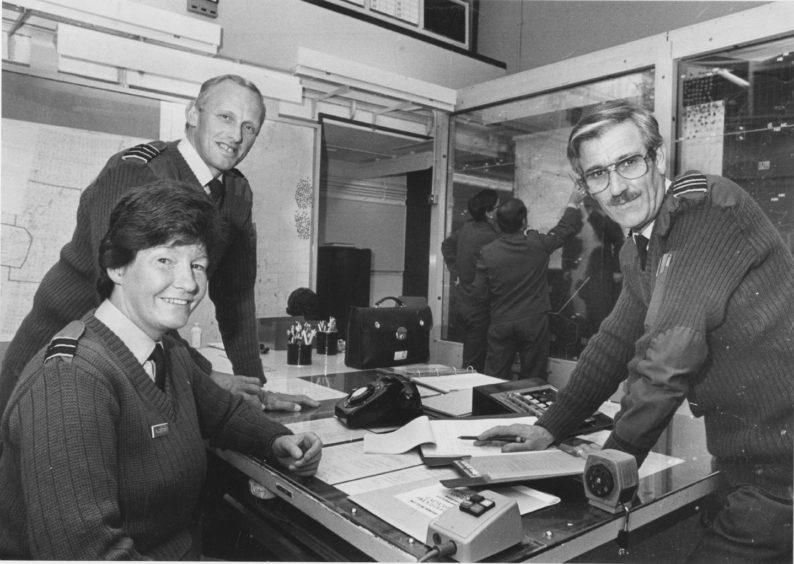 1987 - Group Commandant Gordon Martin, at rear, Crew Officer Carol Allerton and Deputy Group Commandant Ian Snedden