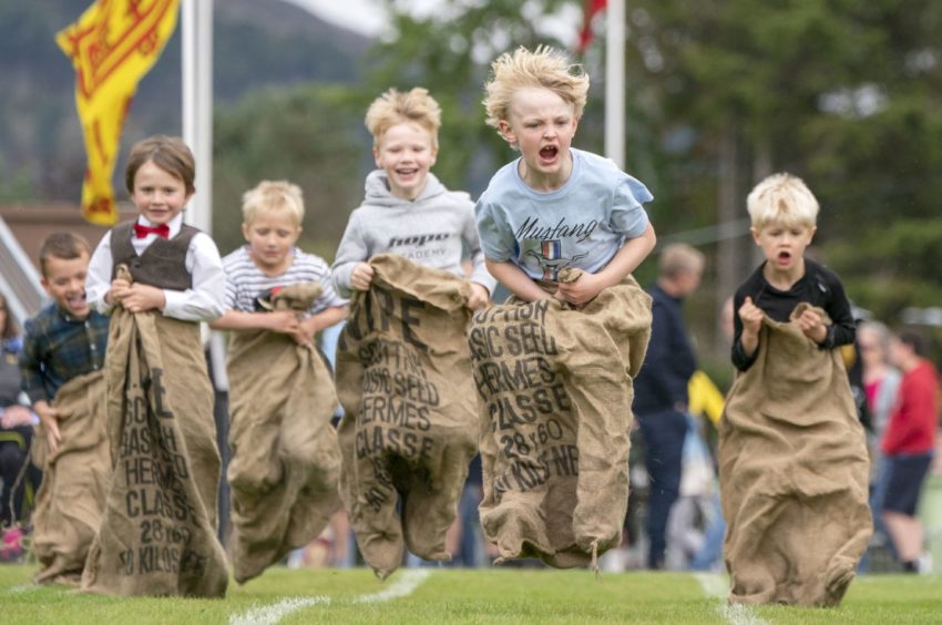 Youngsters take part in the Sack Race.
Photo: Jane Barlow/PA
