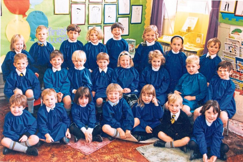 The young pupils from Miss Ferries’ primary 1F class line up for their school photograph