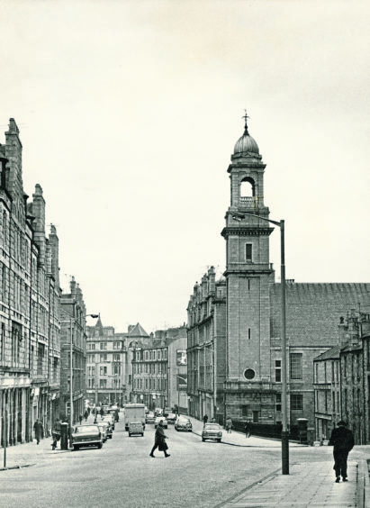 1969: Linking with the centre of Aberdeen is the separate shopping area of Rosemount, which contrives to keep abreast of the times and yet maintain a character all its own. This is the view from the South Mount Street.