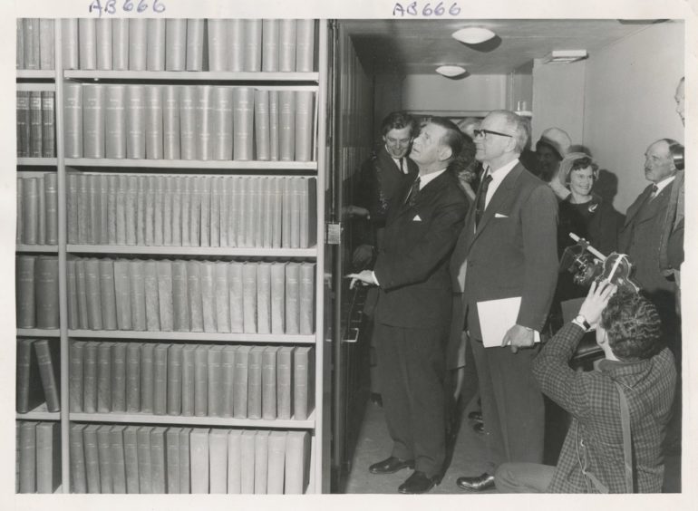1967: Opening of the Charles Alexander Wing of the Reid Library at the Rowett Research Institute yesterday. Mr William Ross the Secretary of the State for Scotland and Mr Charles Alexander examine the library with mobile shelves to facilitate storage.