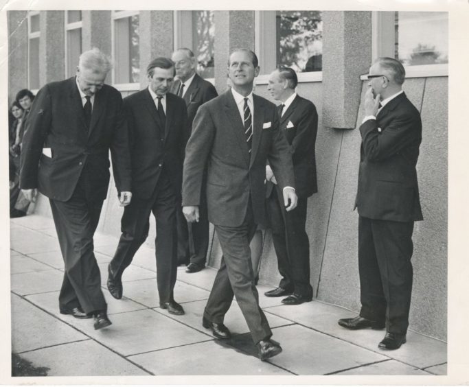 1970: After officially opening the new ring at the Rowett The Duke of Edinburgh sets off on a tour of the building accompanied by Principal E. M. Wright and Dr K. L. Blaxter.