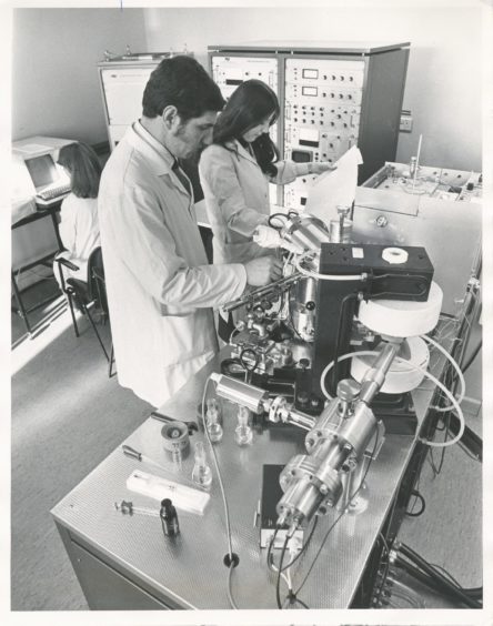 1979: One of the Rowett Institute's latest, and most expensive pieces of equipment is a mass spectrometer - for the analysis of organic material. Using the spectrometer are Dr Alistair and June Walker.
